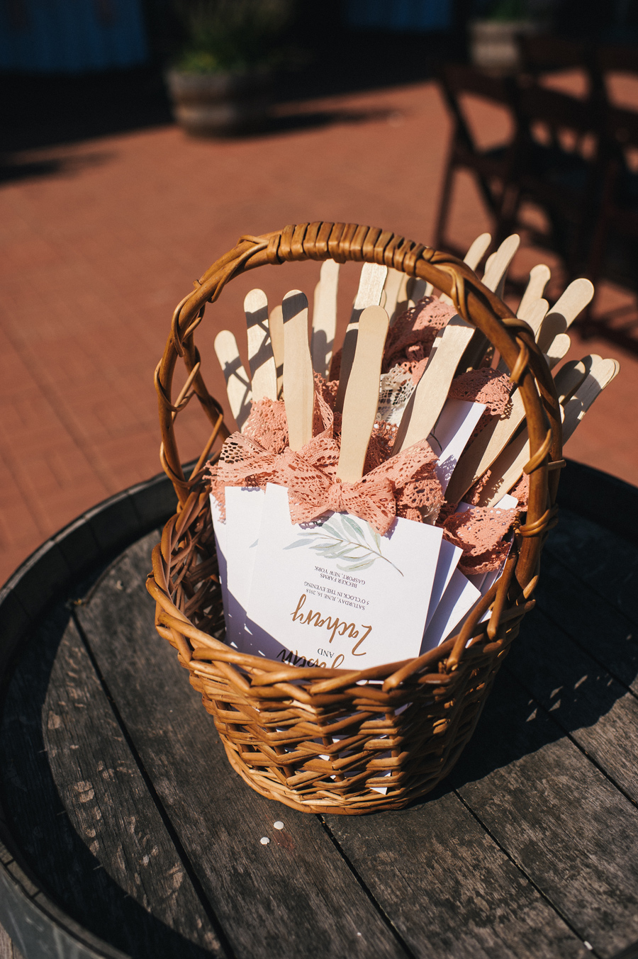 wedding ceremony programs in a basket