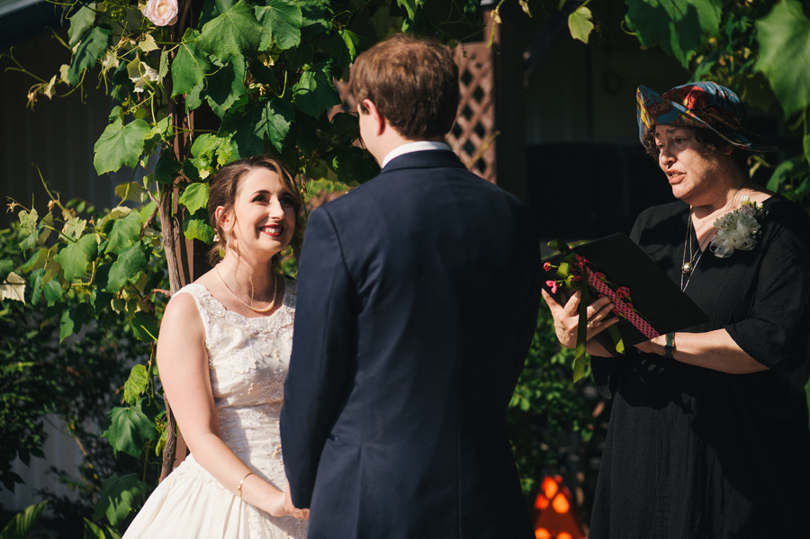 bride smiling up at groom during the wedding ceremony