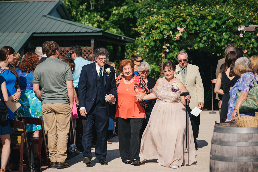 parents and grandparents of the bride walking up the aisle after ceremony