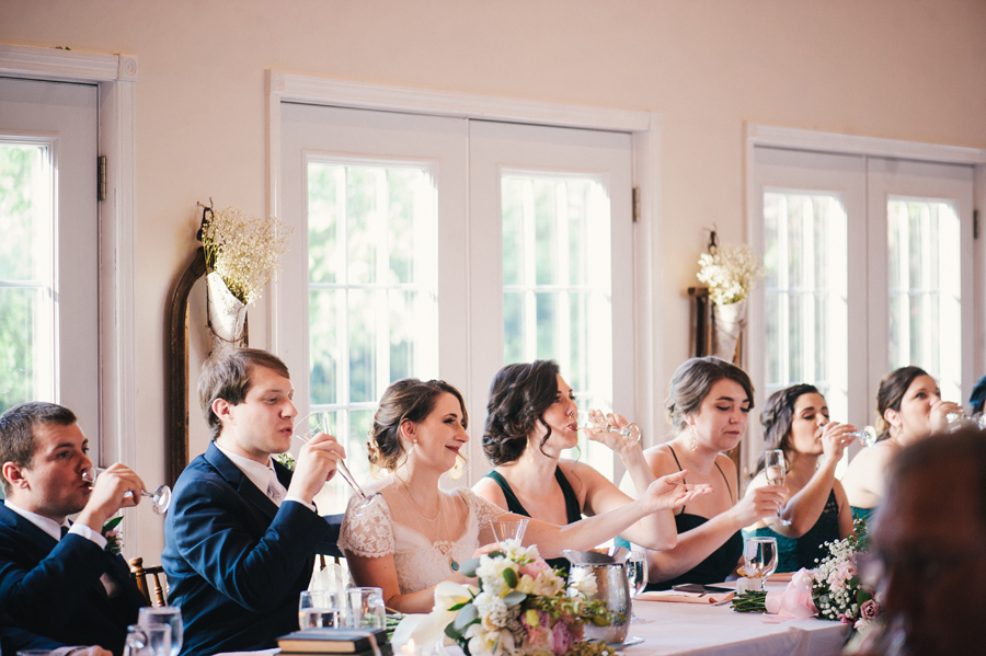 head table doing champagne toast after speech at reception