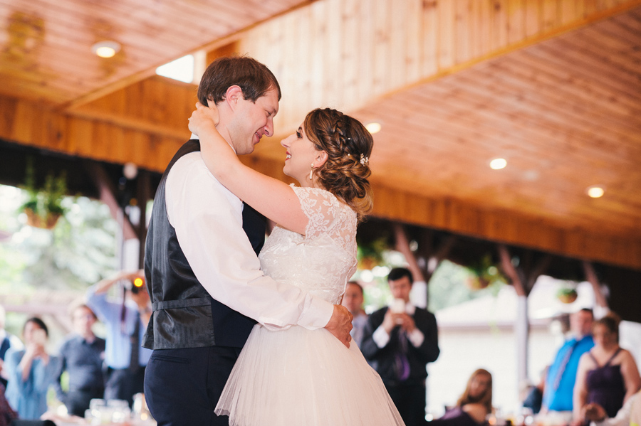bride and groom smiling during first dance