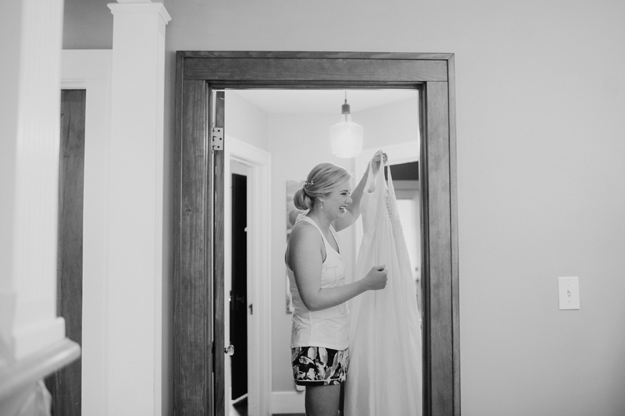 bride holding up her wedding dress