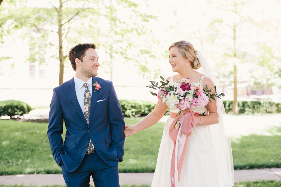 bride and groom doing a first look in the park