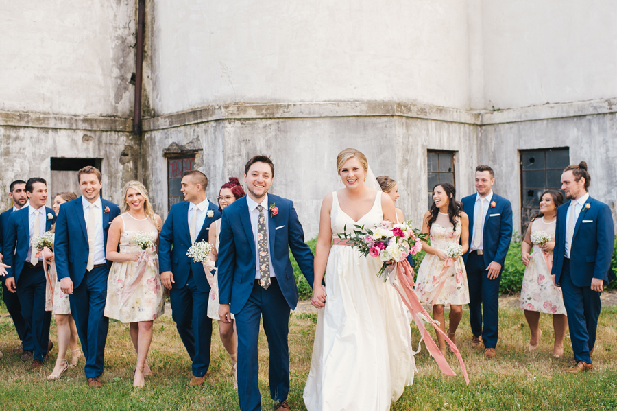 bridal party walking towards the camera at silo city