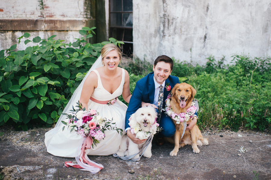 bride and groom with their dogs at silo city