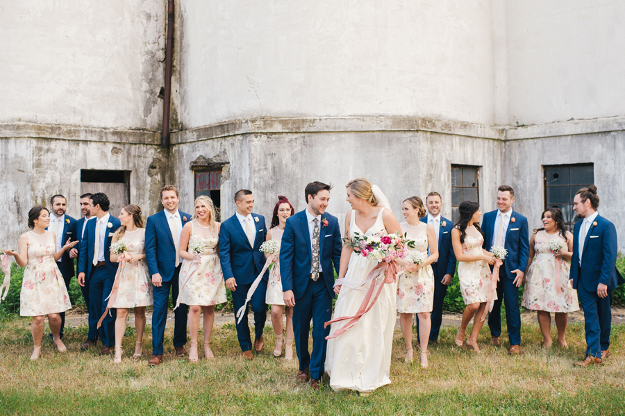 wedding party walking towards camera and laughing