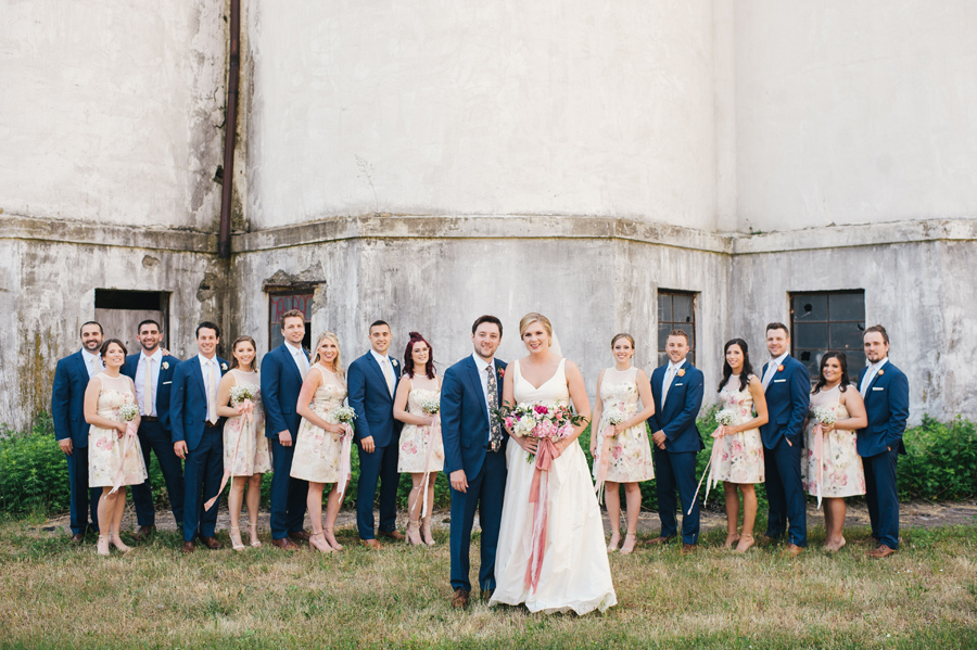 formal wedding party photo in front of silo city