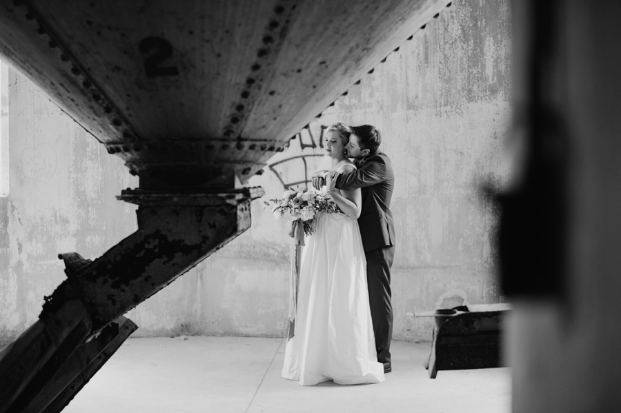 black and white photo of bride and groom inside silo city