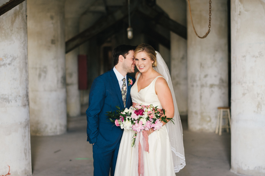 happy bride and groom in the grain silos