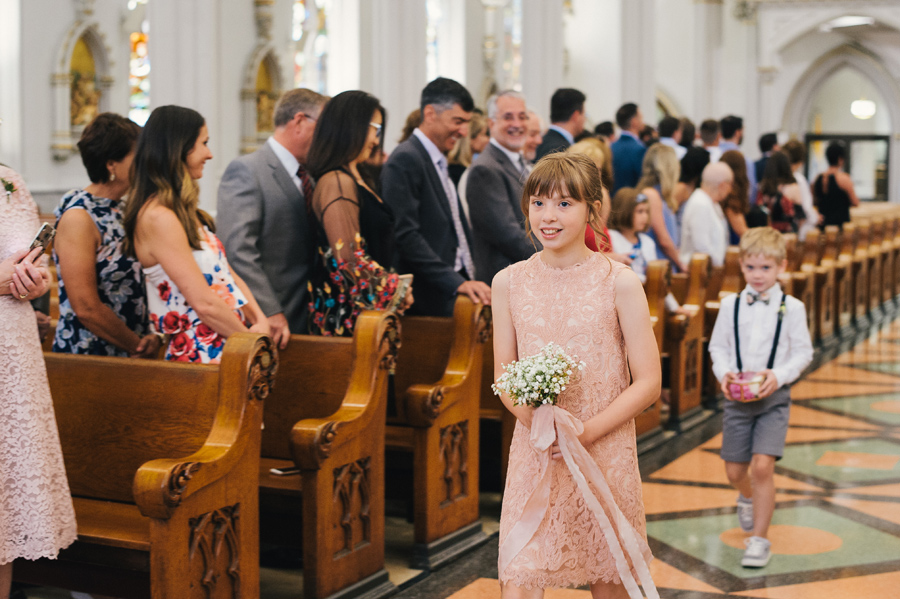 junior bridesmaid and ring bearer walking down the aisle