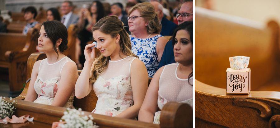 bridesmaid wiping tears with tissue box which says tears of joy