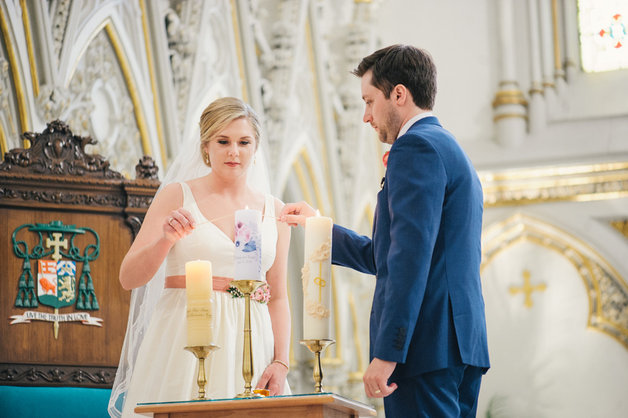 bride and groom lighting unity candles