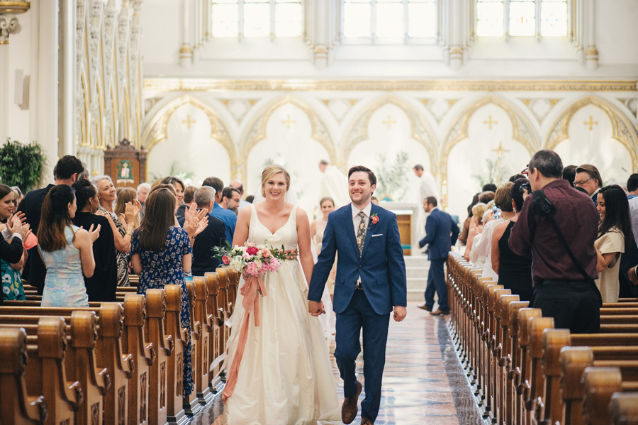 bride and groom walking up the aisle after the ceremony