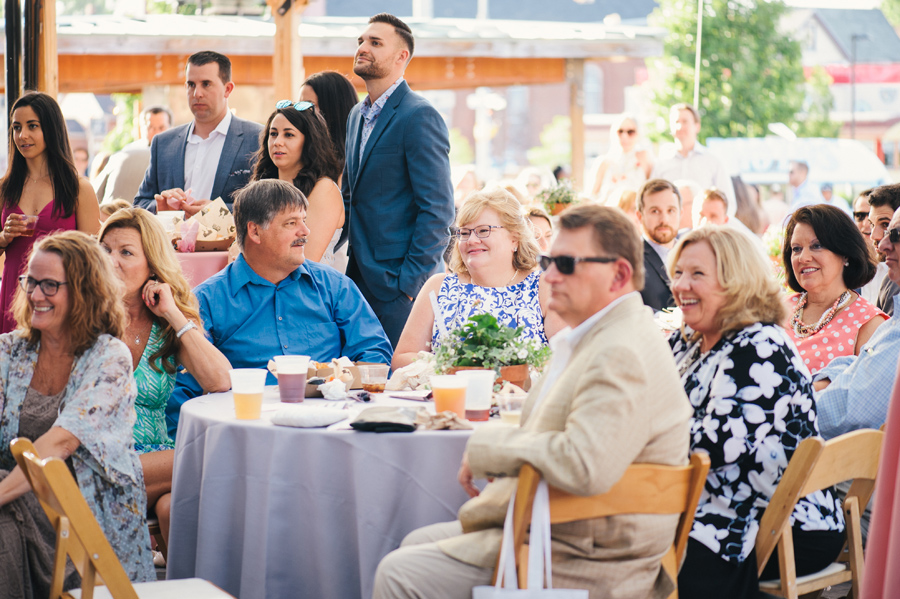 wedding guests enjoying the speeches at the reception