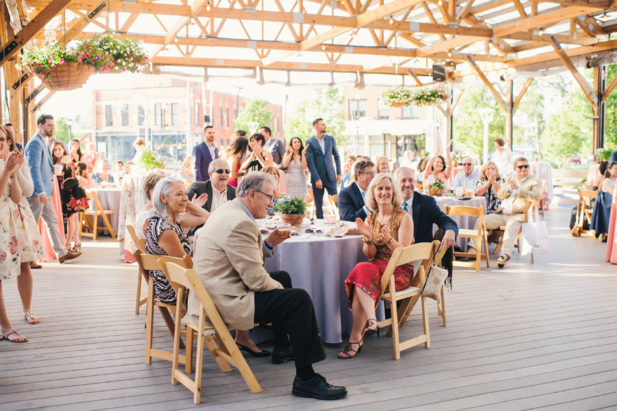 wedding guests cheering for father daughter dance