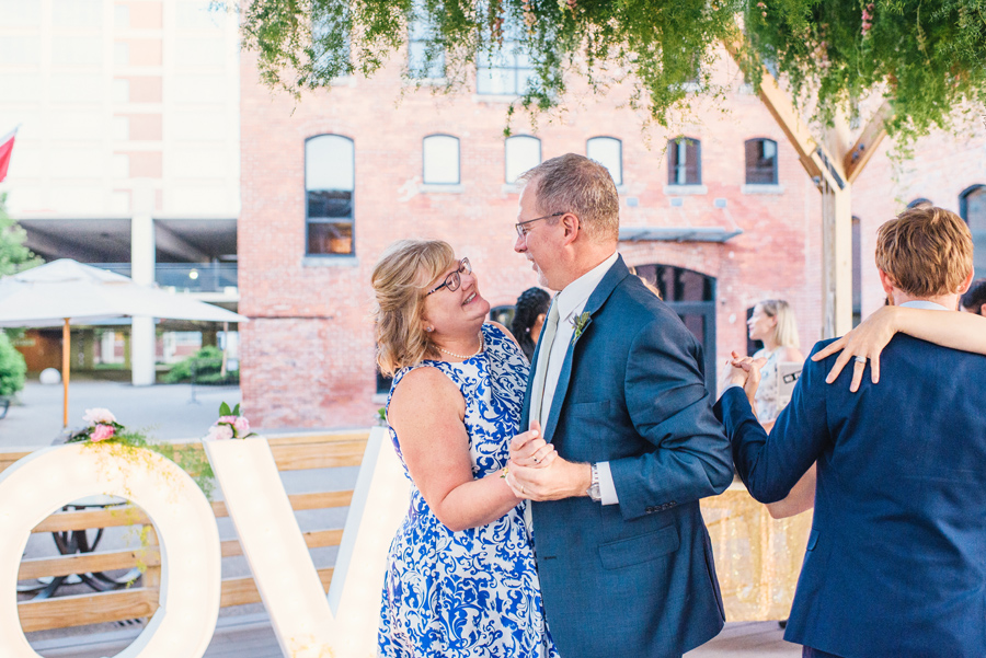 mother and father of the bride dancing together