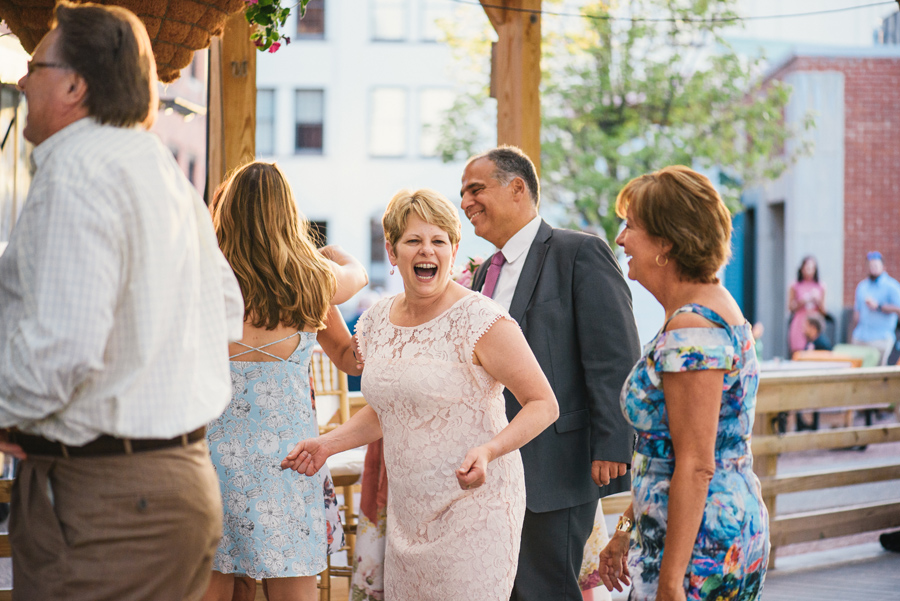 wedding guests enjoying themselves on the dance floor