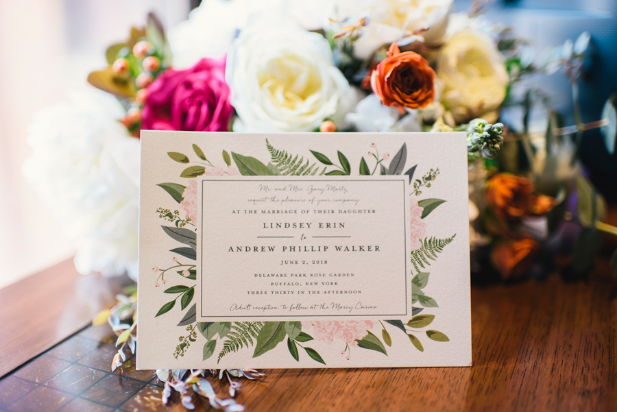 wedding invitation and bouquet close up