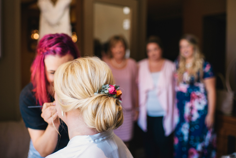 bride receiving makeup service from rachel rizzo hair and makeup