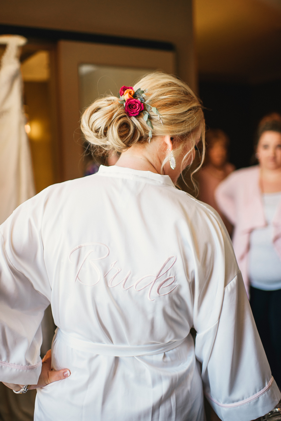 bride wearing special bridal robe while getting ready at curtiss hotel