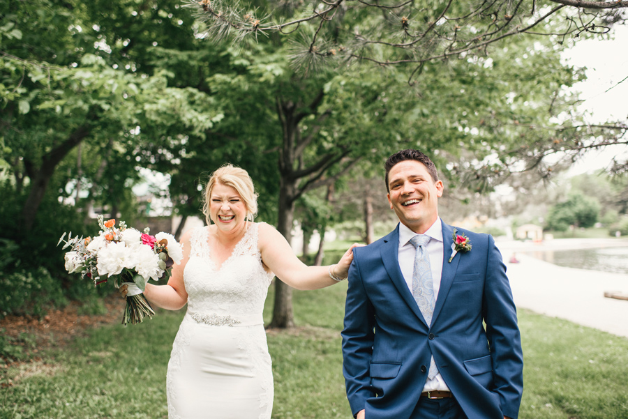 bride and groom laughing just before their first look