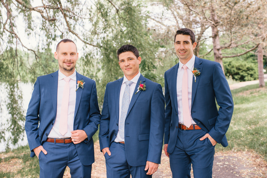 groom and his groomsmen in delaware park with blue suits