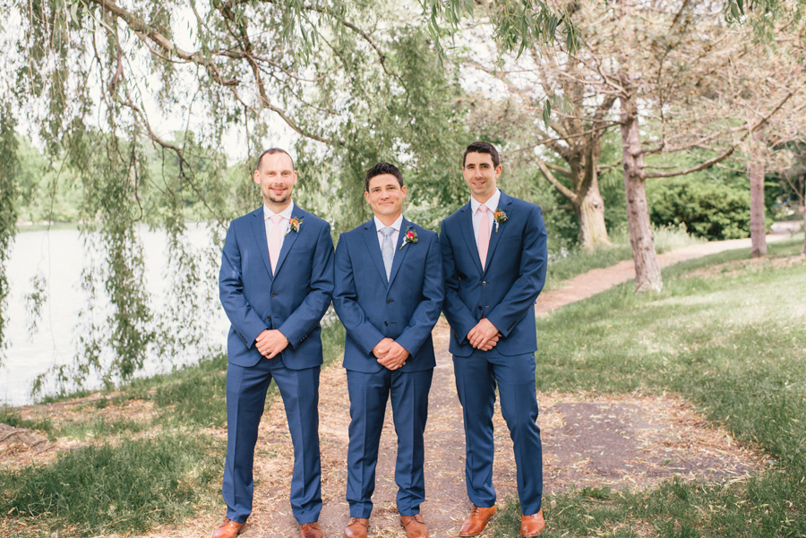 groomsmen in blue suits next to hoyt lake