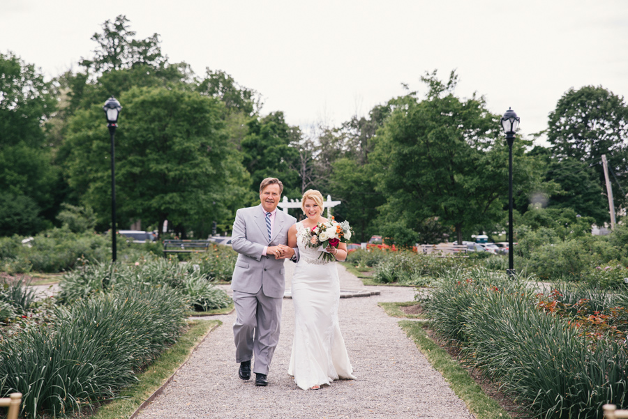 bride walking down the aisle with her father