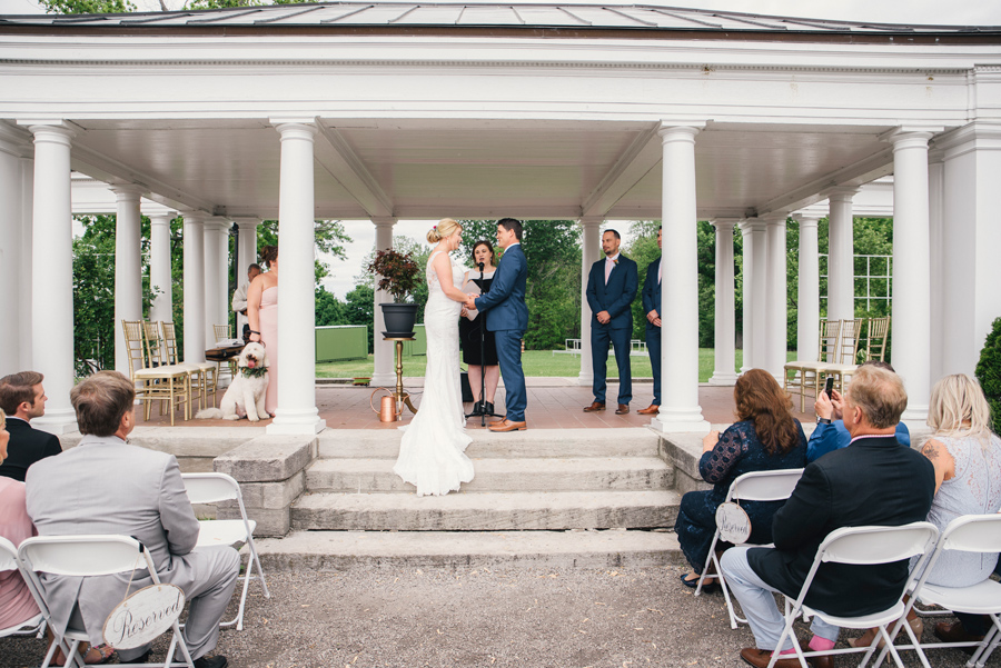 bride and groom at the altar at delaware park rose garden wedding ceremony