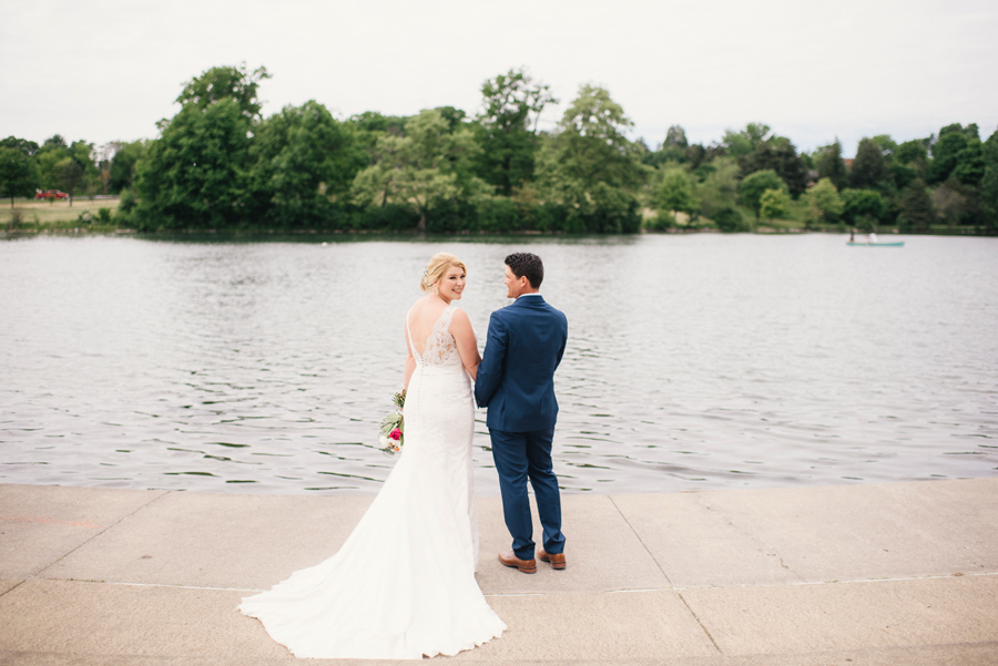 bride and groom by the water at hoyt lake