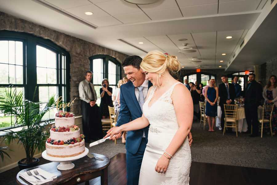 bride and groom cutting cake made by blue eyed baker