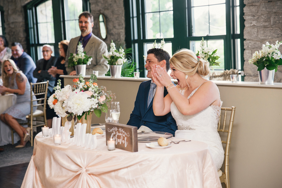 bride and groom cheering during the speeches