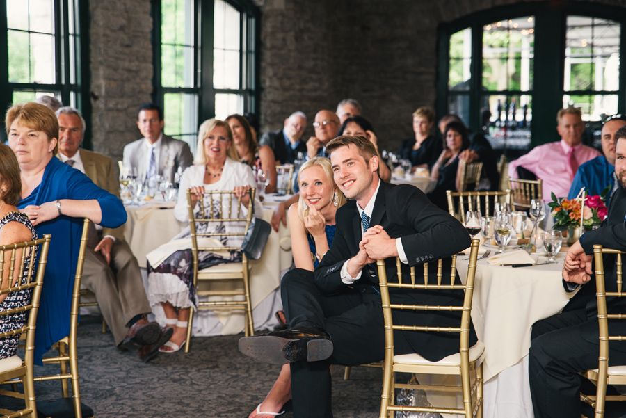 wedding guests looking on during the speeches