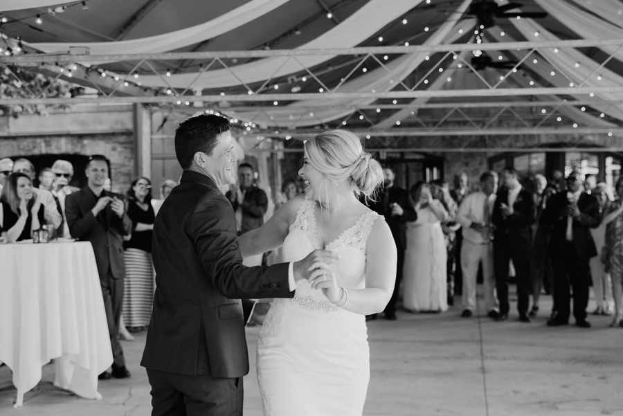 black and white of bride and groom during first dance