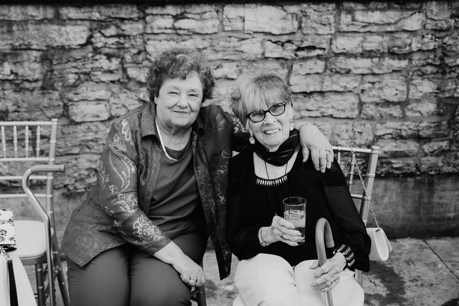 black and white portrait of two elderly wedding guests