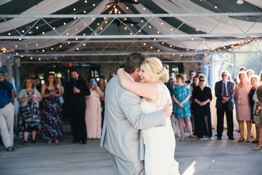 bride hugging her father on the dance floor