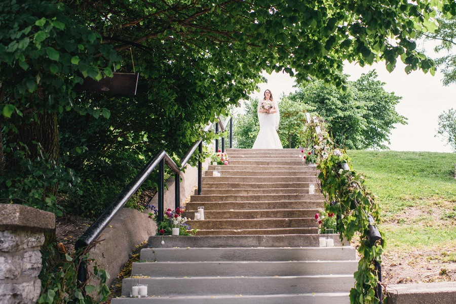 bride standing at the top of the stairs at the marcy casino