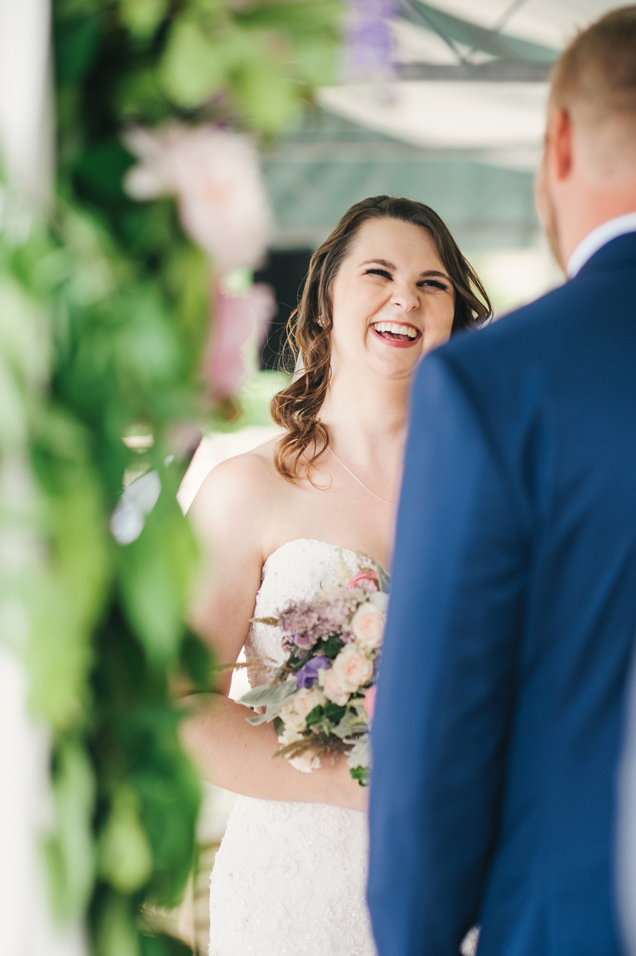 bride laughing during the wedding ceremony