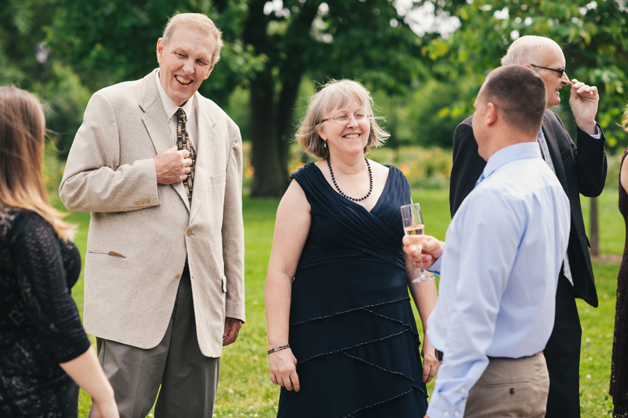 groom's parents mingling with wedding guests