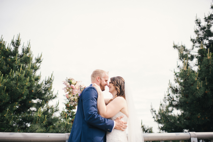 bride and groom smiling at each other