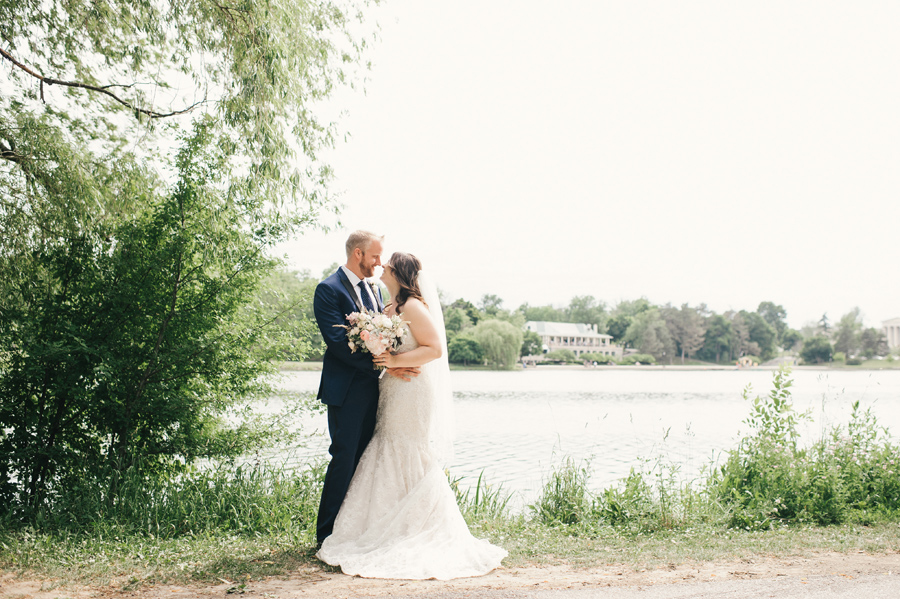 bride and groom in front of hoyt lake across from marcy casino