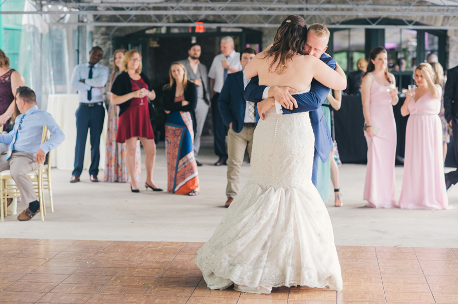 bride and groom hugging on the dance floor