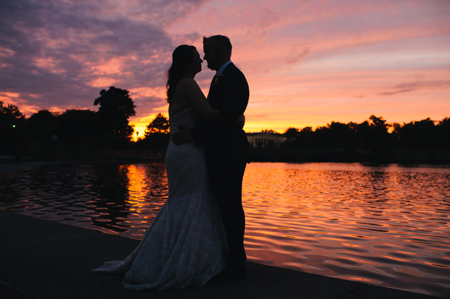 silhouette of bride and groom by hoyt lake at sunset