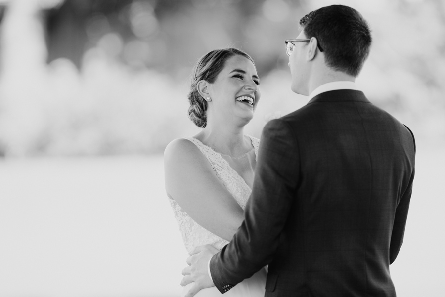 black and white of bride and groom during their first look