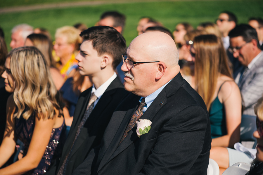 wedding guests looking on during the ceremony