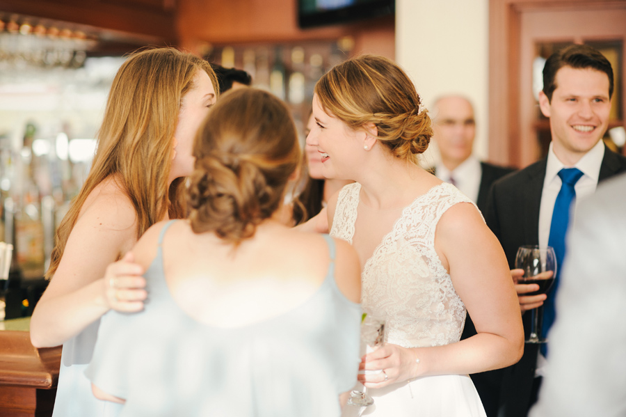 bride mingling with guests at her wedding cocktail hour