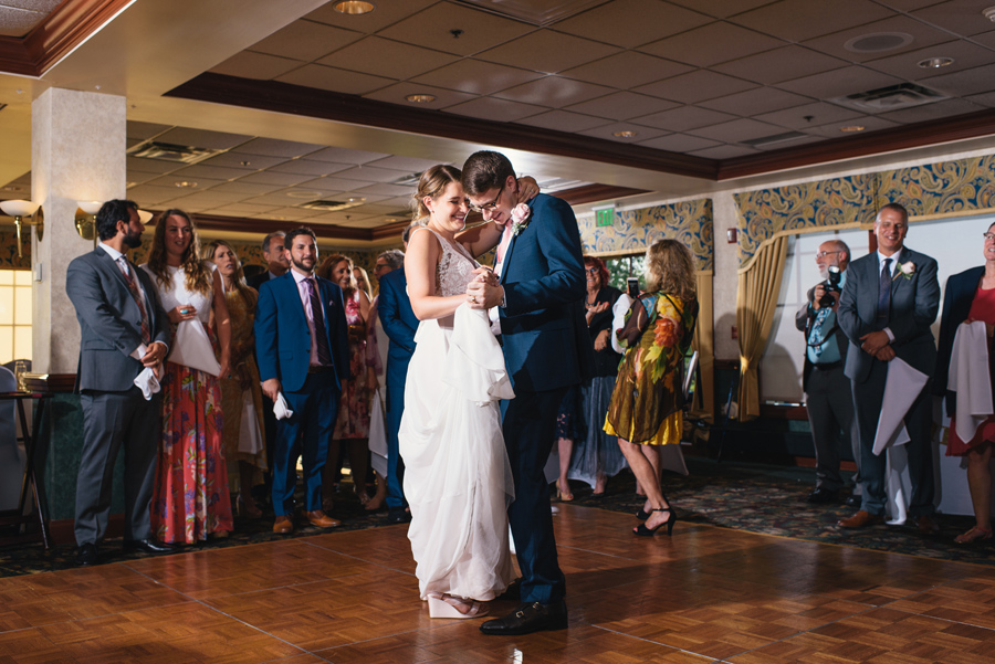 bride and groom smiling during first dance