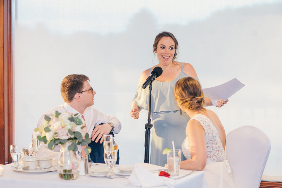 maid of honor giving a speech at the wedding reception