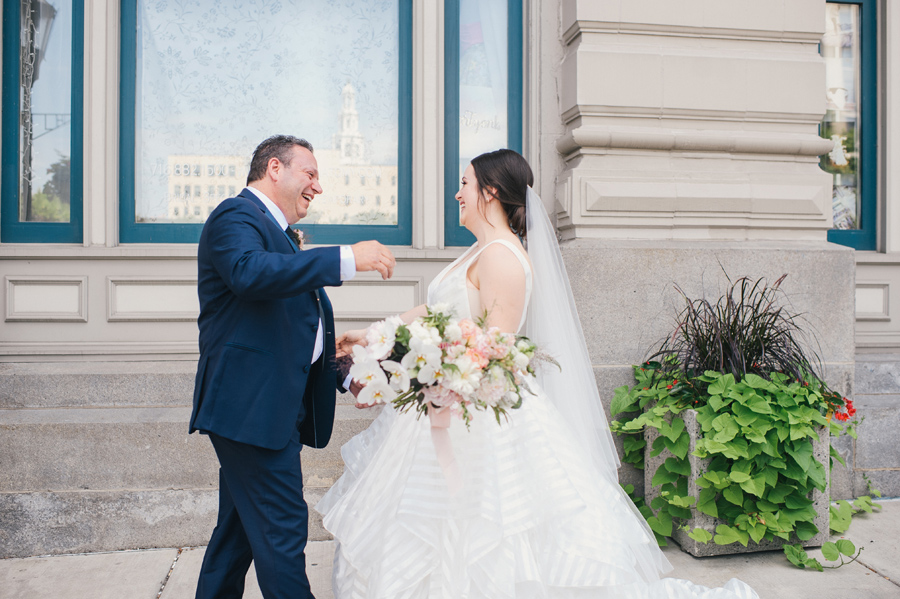 bride and her father seeing each other for the first time on wedding day