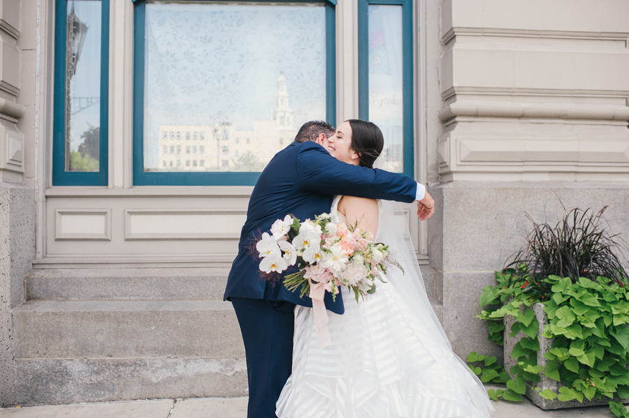 father of the bride embracing his daughter after first seeing her on wedding morning